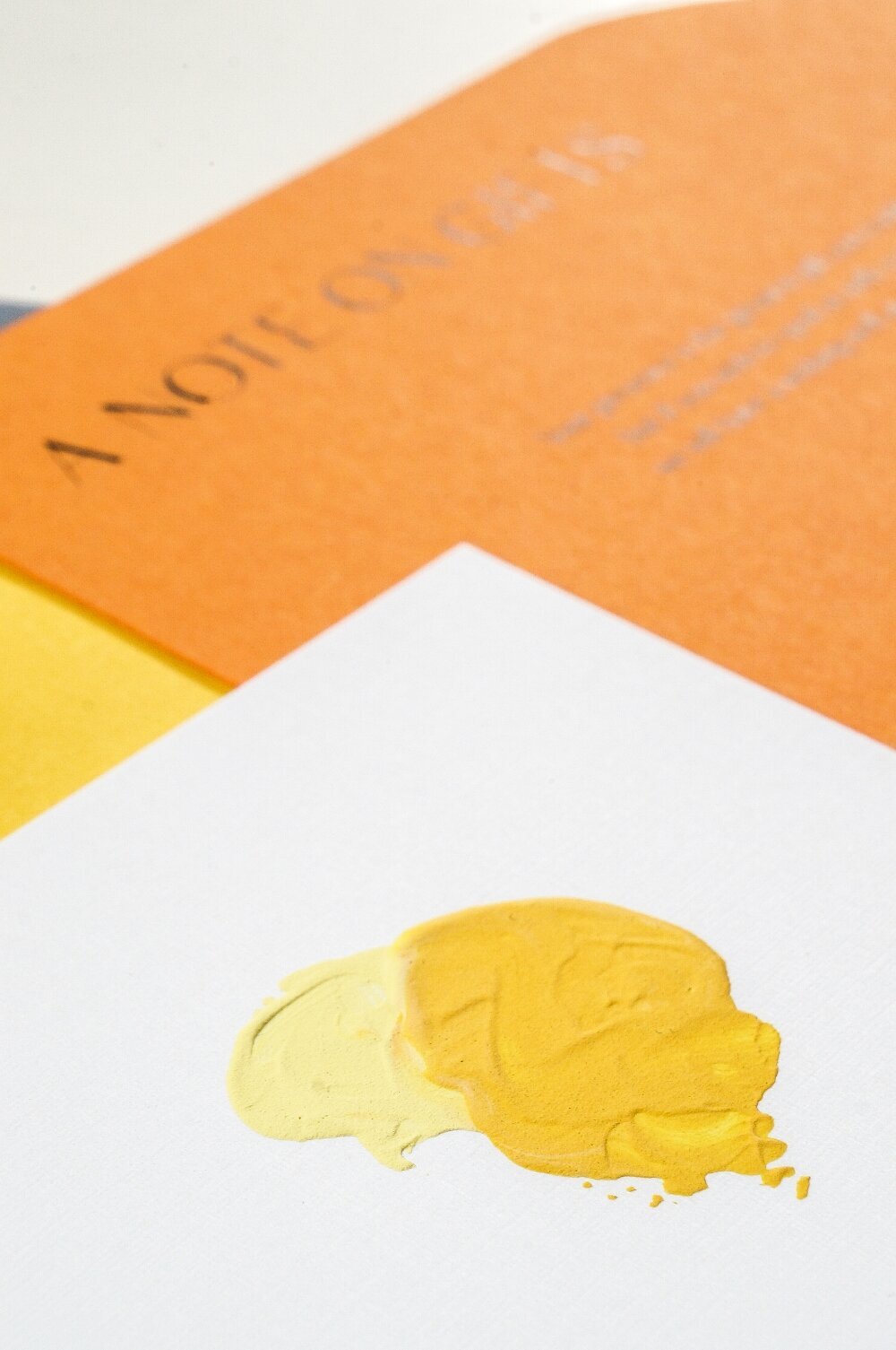 Yellow-painted-bright-orange-wedding-invitations