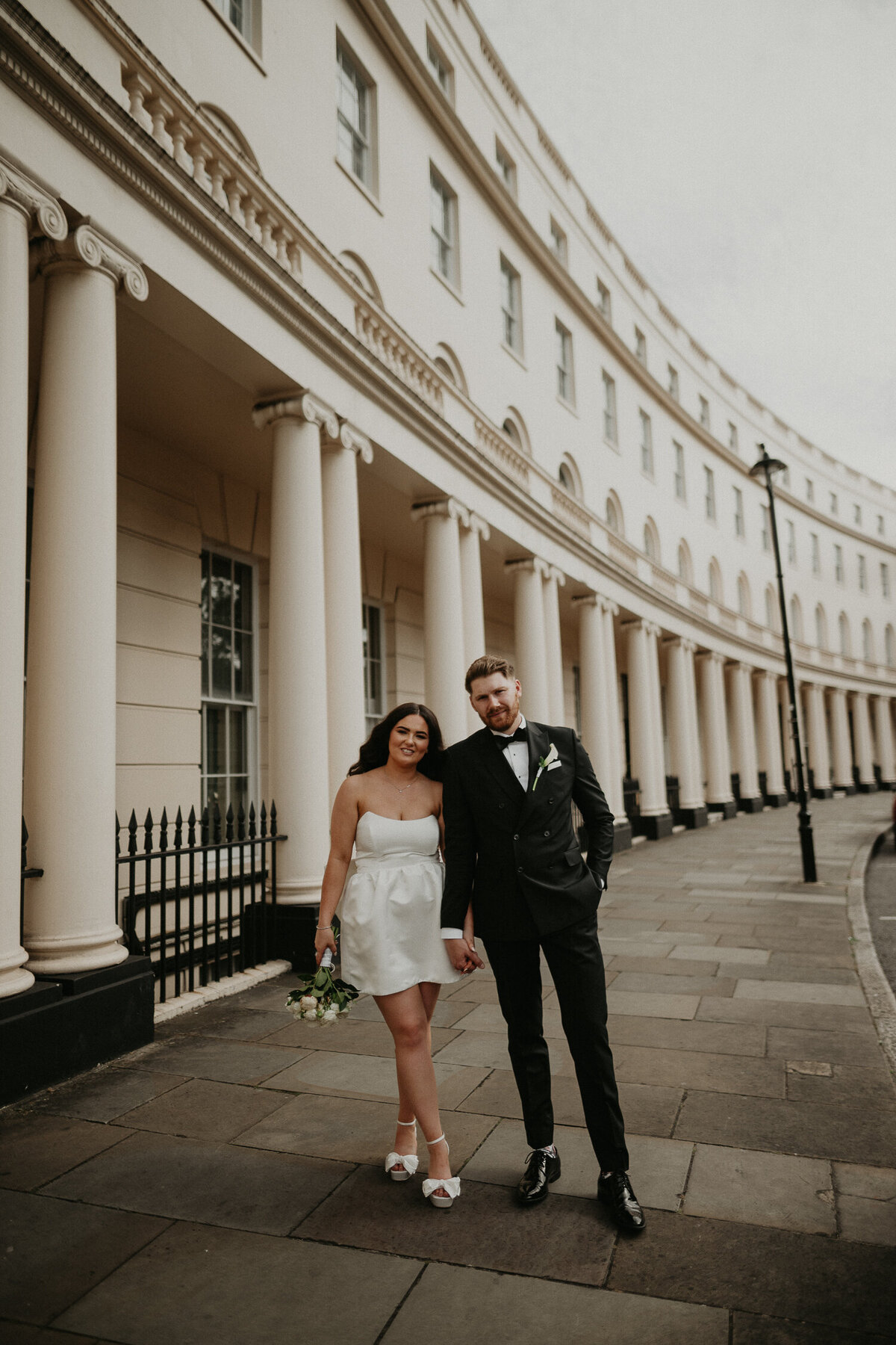 A bride and groom at Regents Curve after their wedding ceremony at The Old Marylebone Town Hall. 