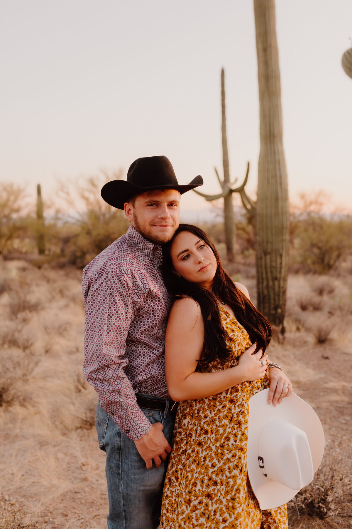 couple posing by cactus