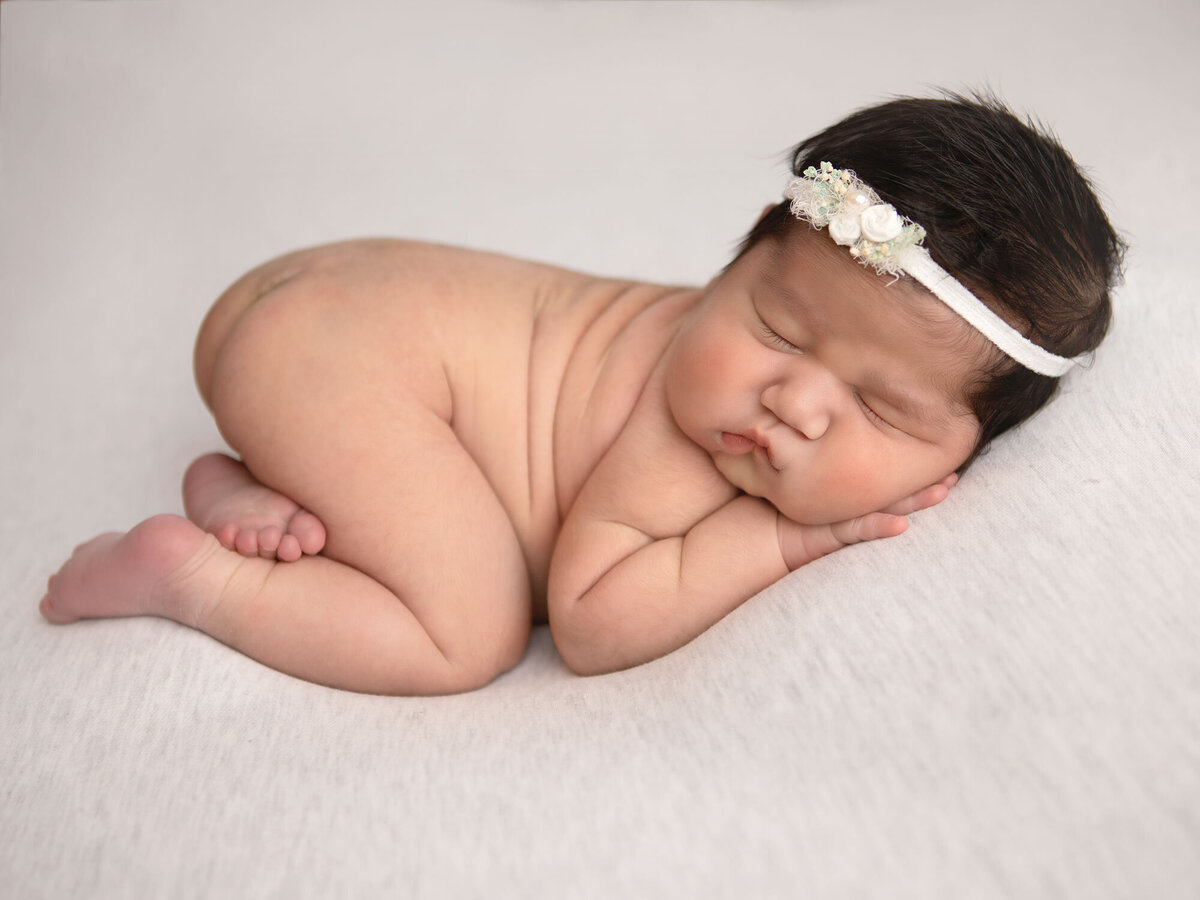 newborn-baby-girl-six-days-old-sleeping-for-her-newborn-session