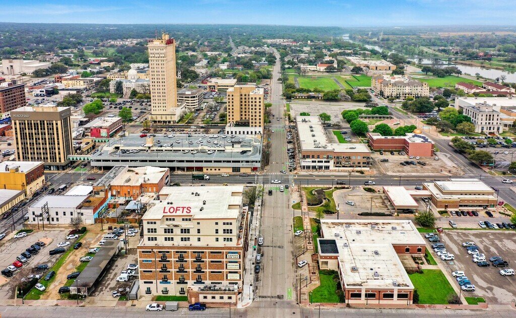 View of downtown Waco which holds this 2 bedroom, 2.5 bathroom luxury vacation rental loft condo for 8 guests with incredible downtown views, free parking, free wifi and professional decor in downtown Waco, TX.