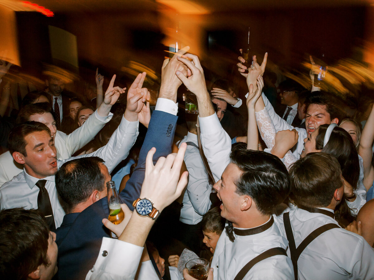 Guests having fun at the wedding reception photographed by Chicago editorial wedding photographer Arielle Peters
