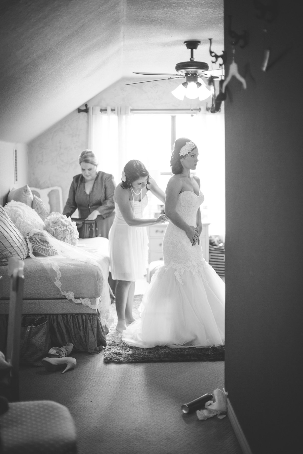 Bridesmaids get bride ready before wedding ceremony at Vista west ranch in Texas Hill Country wedding