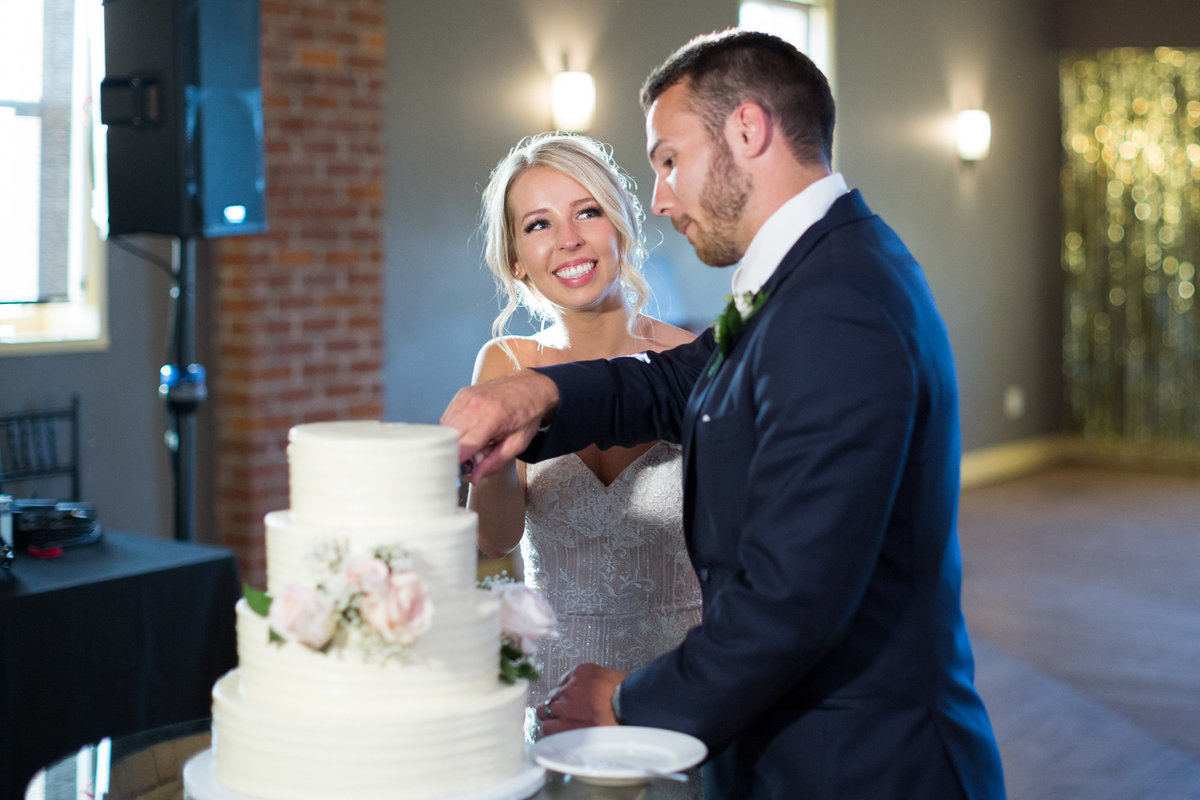 Wedding Cake cutting photograph at Cannon River Winery & Vineyard