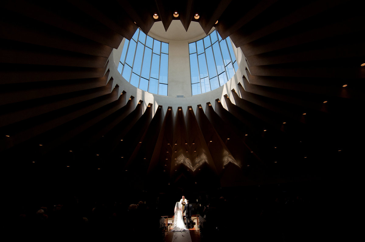 circular skylight above the bride and groom in a Catholic Church