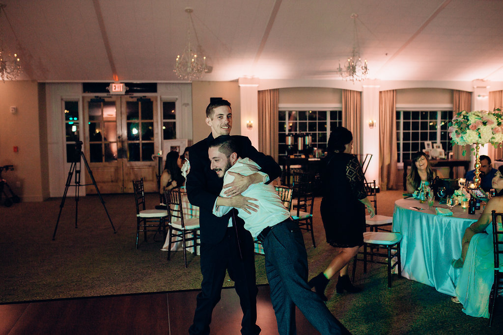Wedding Photograph Of Man In White Long Sleeves Hugging The Groom Los Angeles