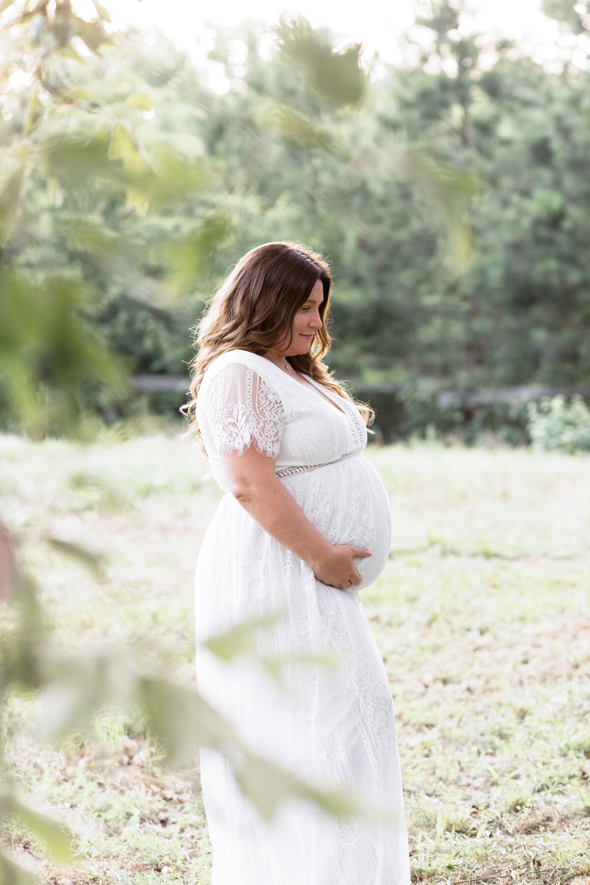 expectant mother in a white gown