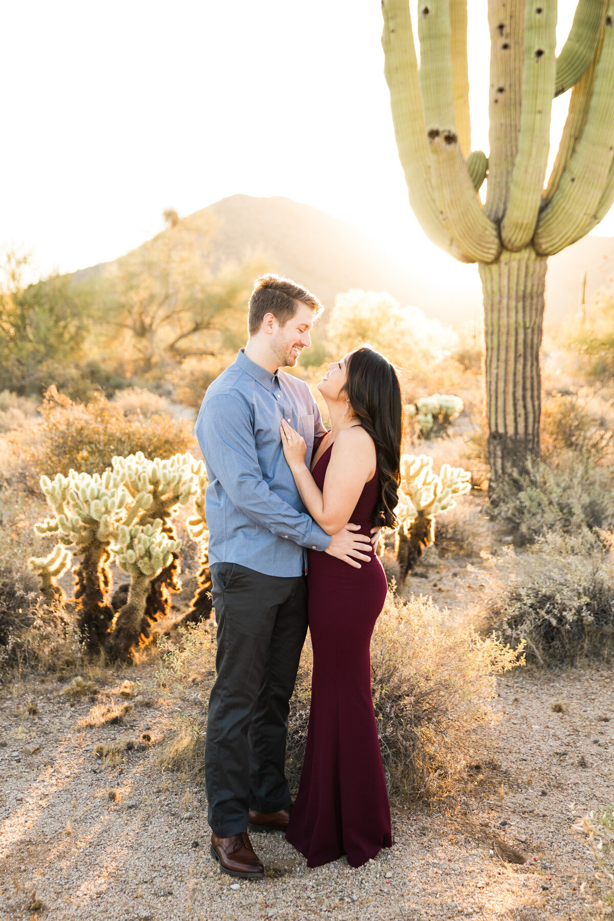 engaged couple posing together for engagement photo in Scottsdale desert