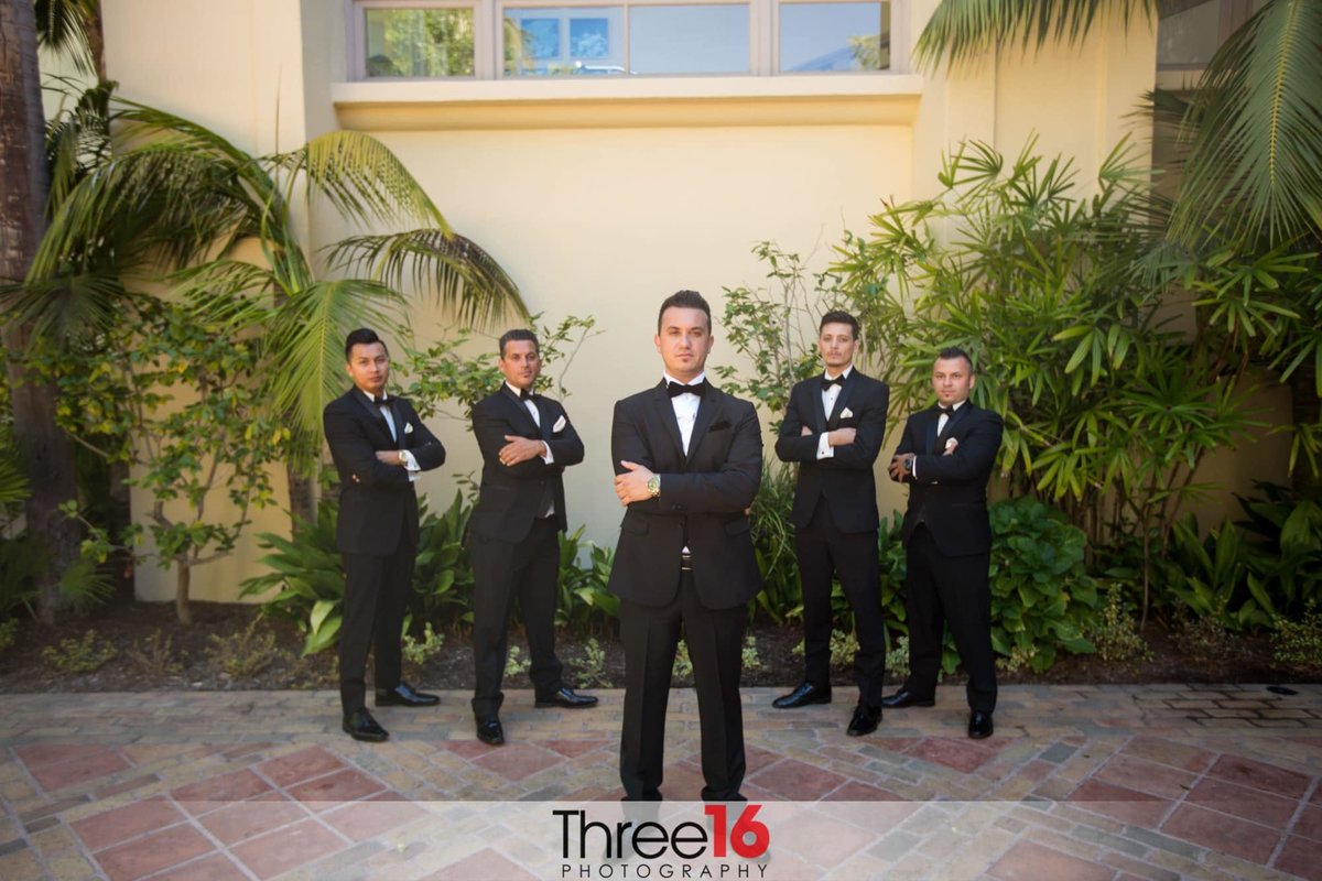 Groom and Groomsmen pose with arms crossed
