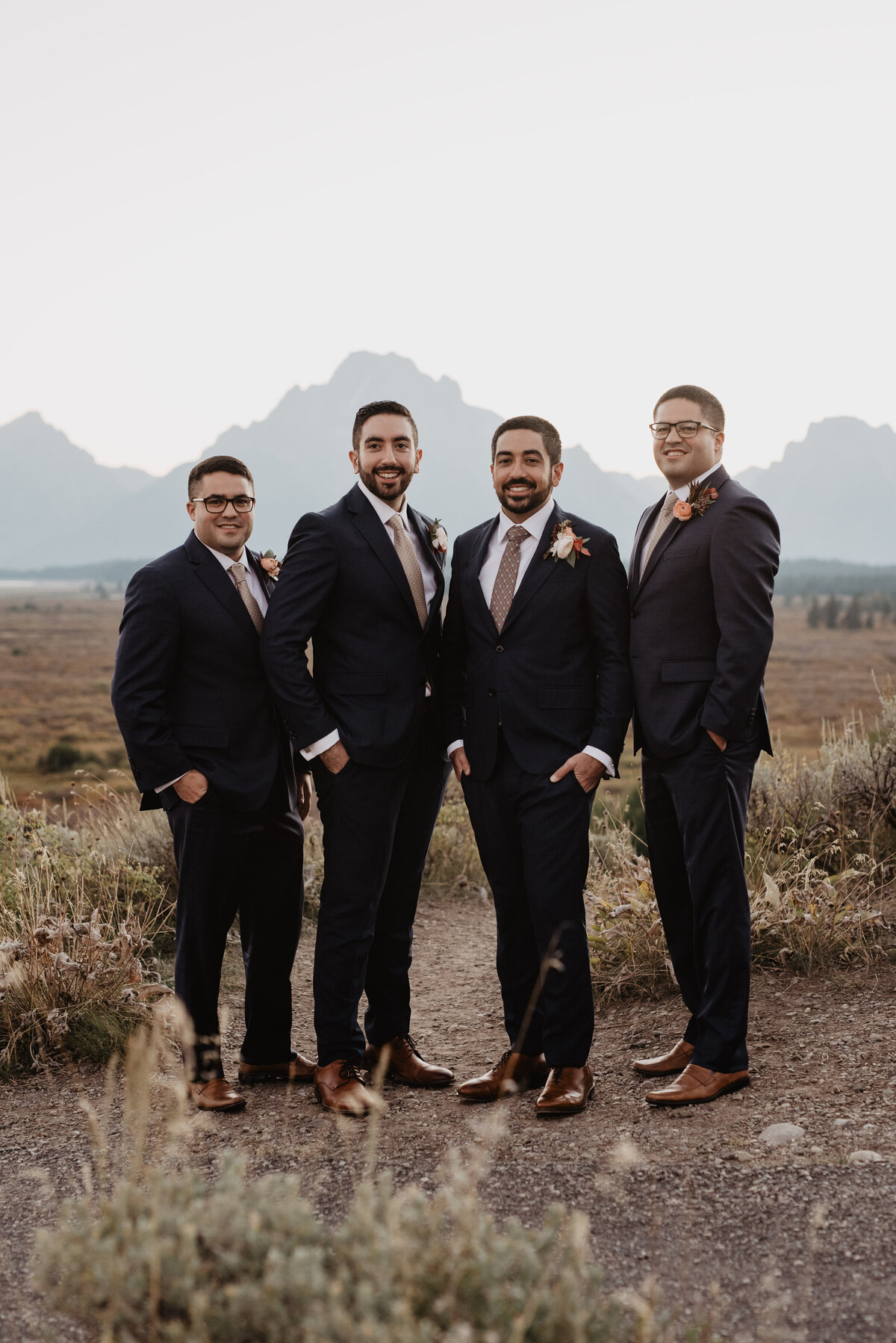 Photographers Jackson Hole capture groom with groomsmen in front of Tetons