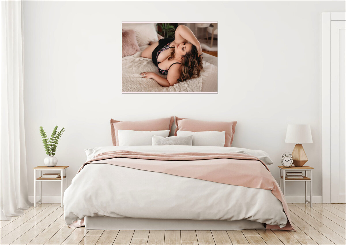 30x40 metal wall art piece of a woman with long brown hair lying on a bed