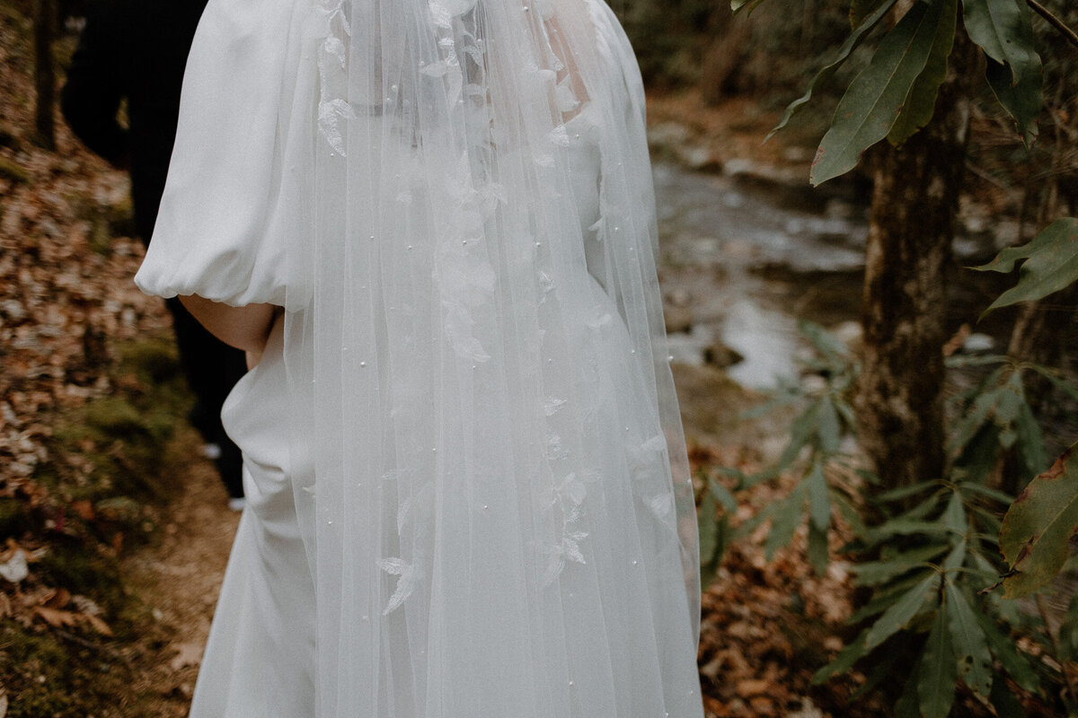 Beautiful details of bride's floral embroidered veil.