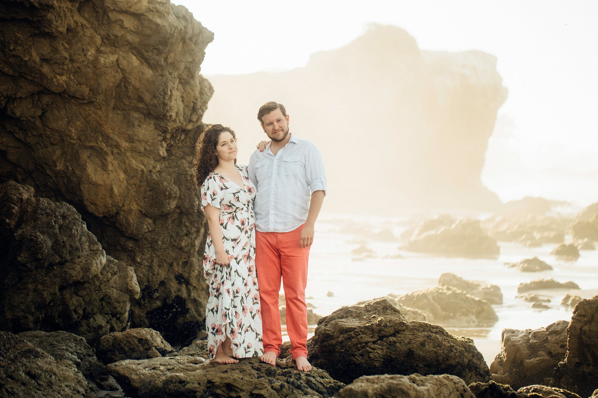 Engagement Photograph Of  Man And Woman Standing In The Middle Of Rocks Los Angeles