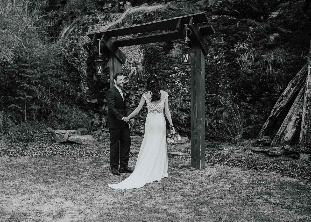 Maddie Rae Photography black and white of the bride meeting her groom at the altar. he has just taken her hand