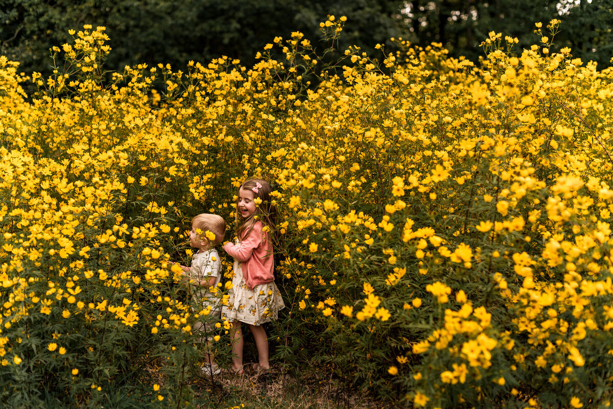 kids laughing by yellow flowers