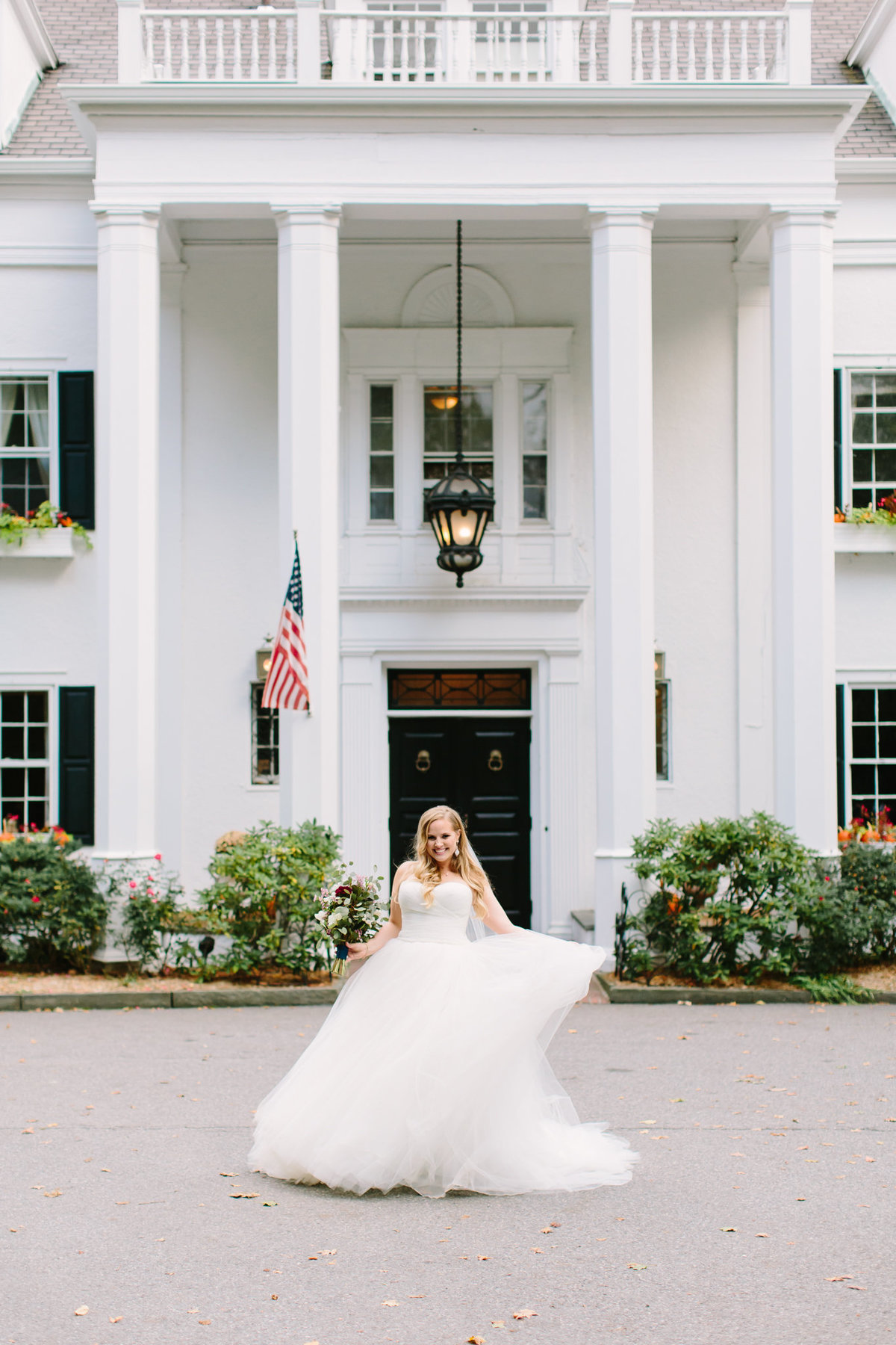 twirling bride in front of Crabtree Kittle House Chappaqua NY
