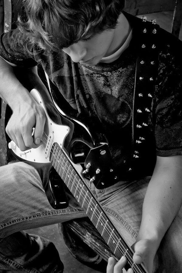 black and white closeup boy with guitar