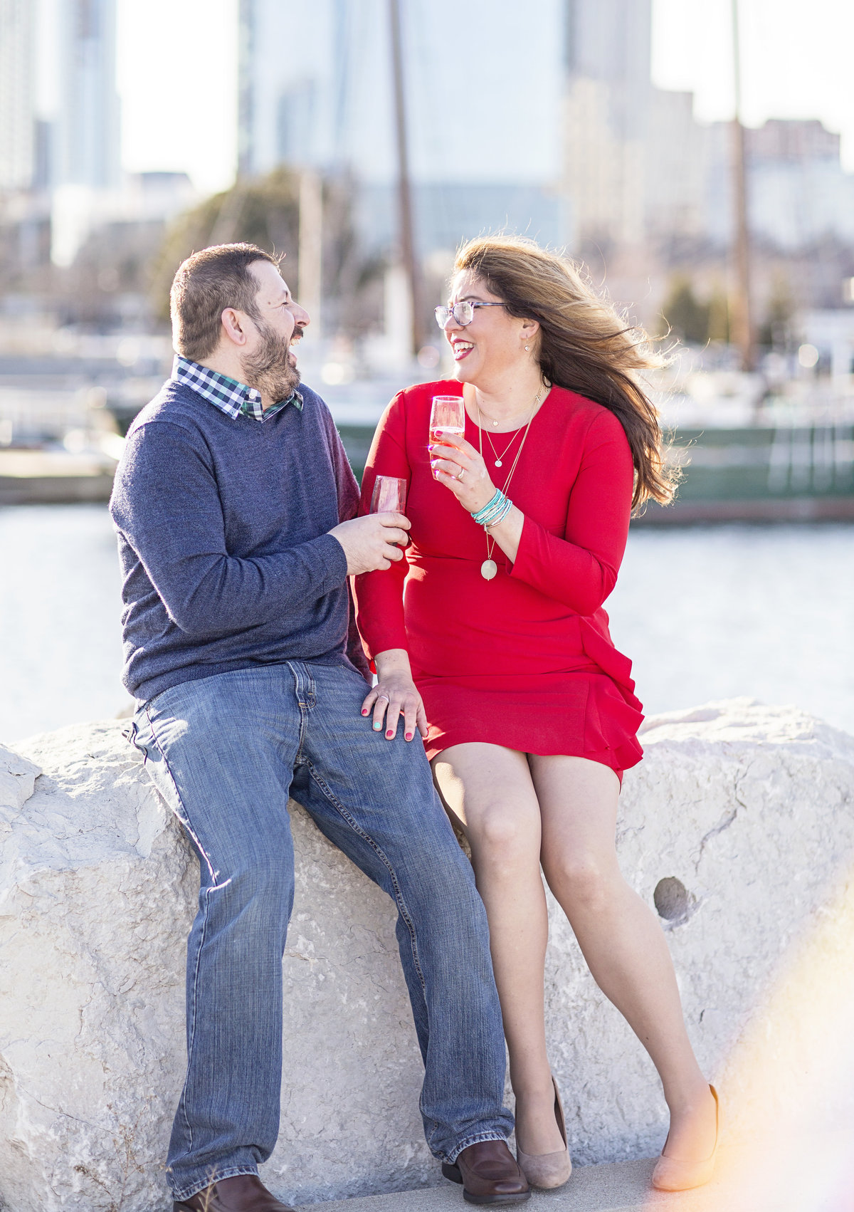 engaged couple with champagne milwaukee engagement photos