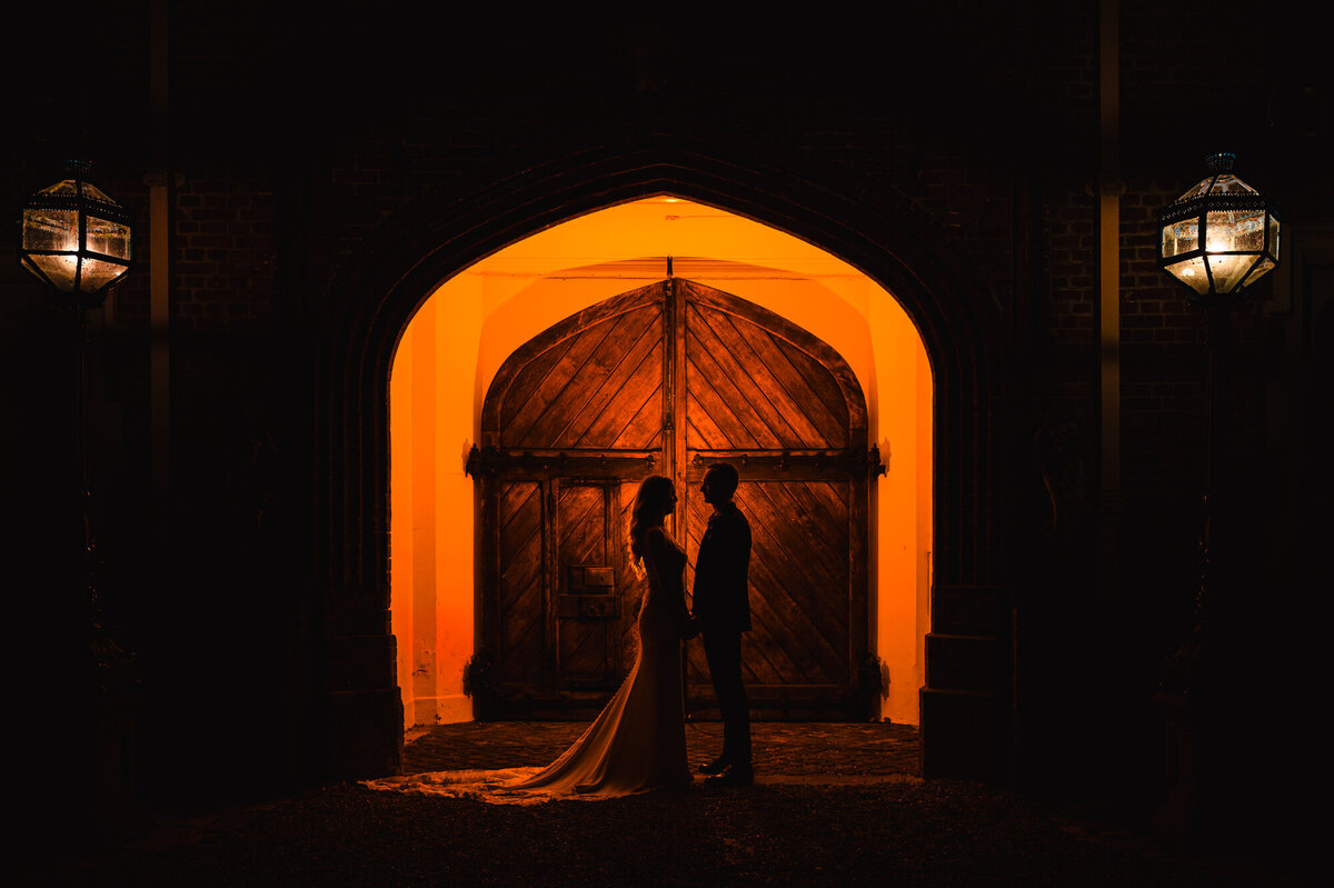 A nighttime silhouette of wedding couple at gosfield hall