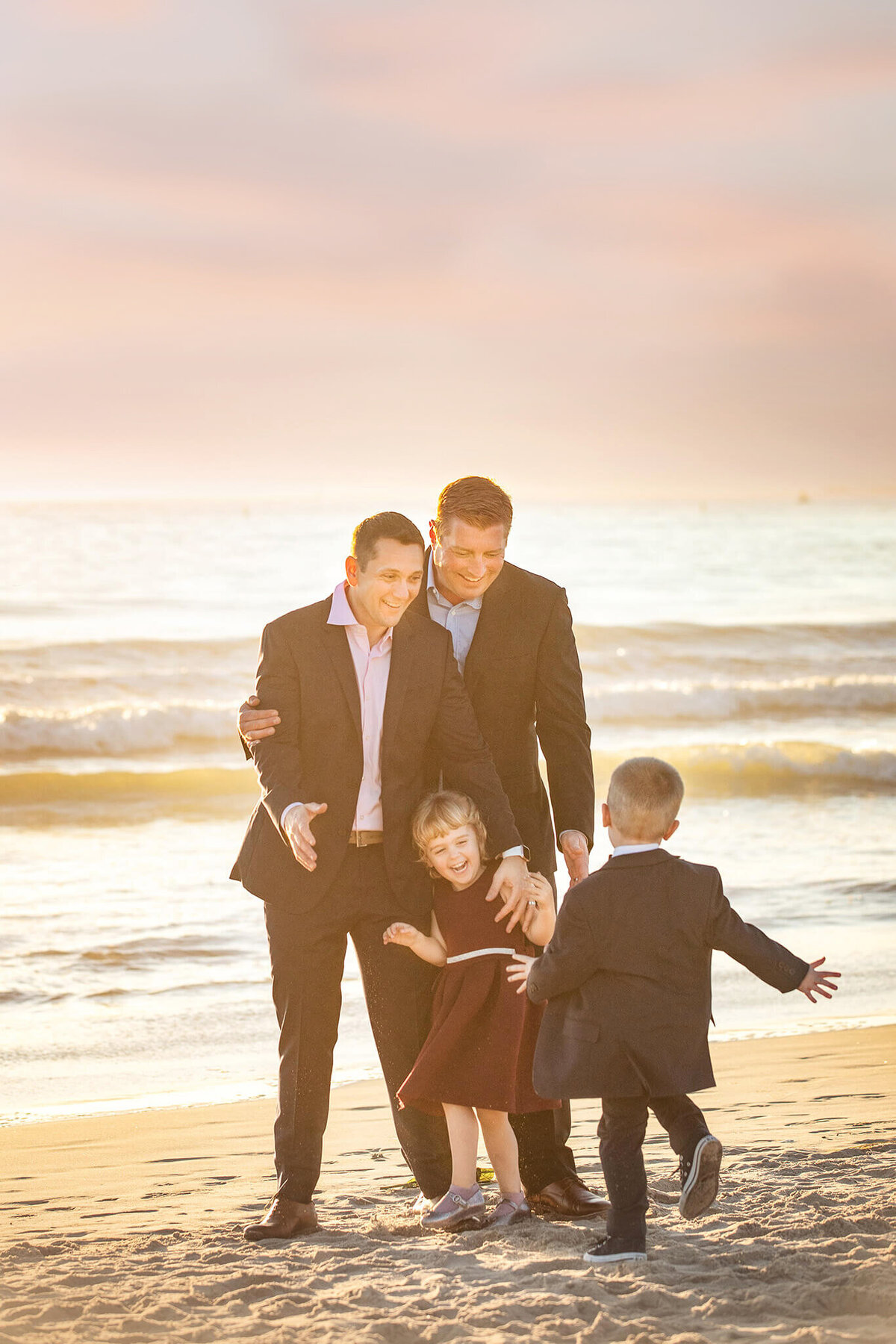 Two dads with thewin twin boy and girl photographed at Santa Monica beach by Los Angeles family photography Elsie Rose Photography