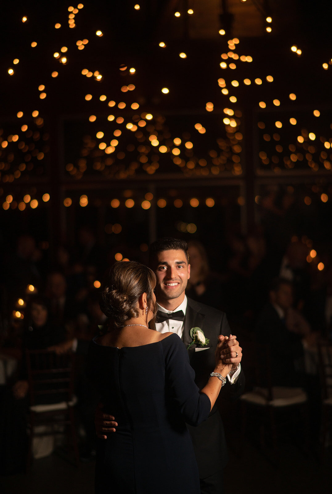 groom dances with his mother during saltwater farm vineyard wedding reception photo by cait fletcher photography