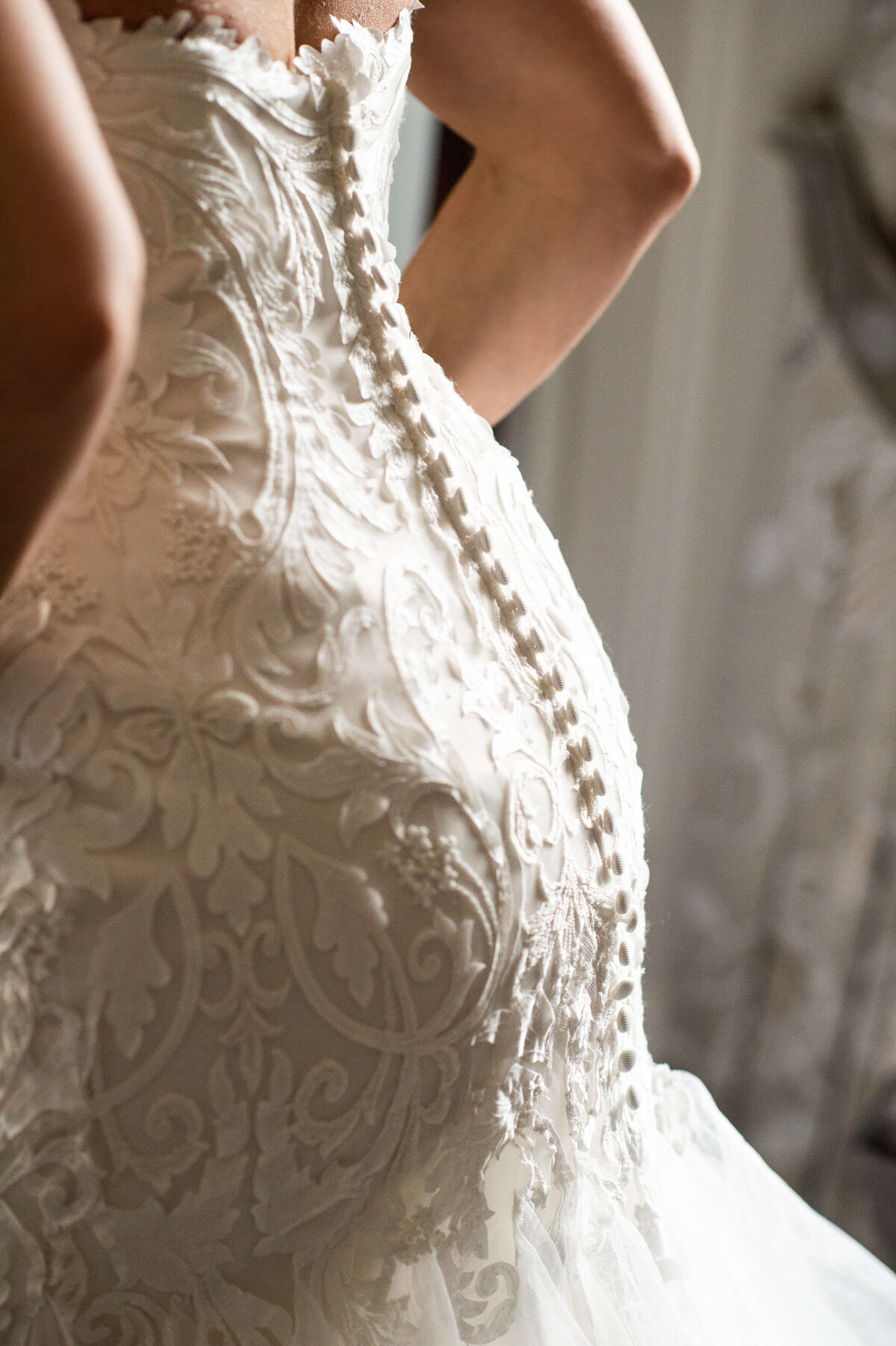 Ottawa wedding photography showing closeup button details of the bride's gown