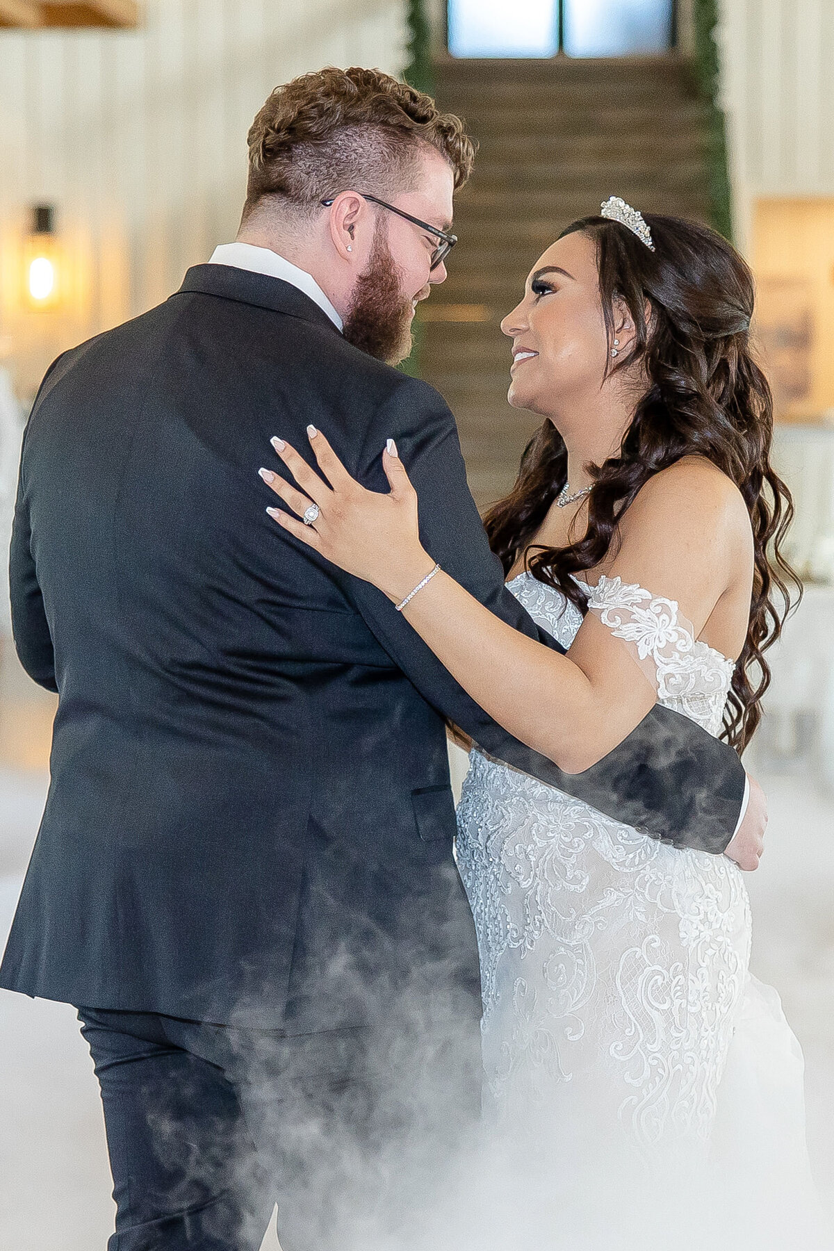 bride and groom dance in the clouds by Fort Worth wedding photographer Firefly Photography