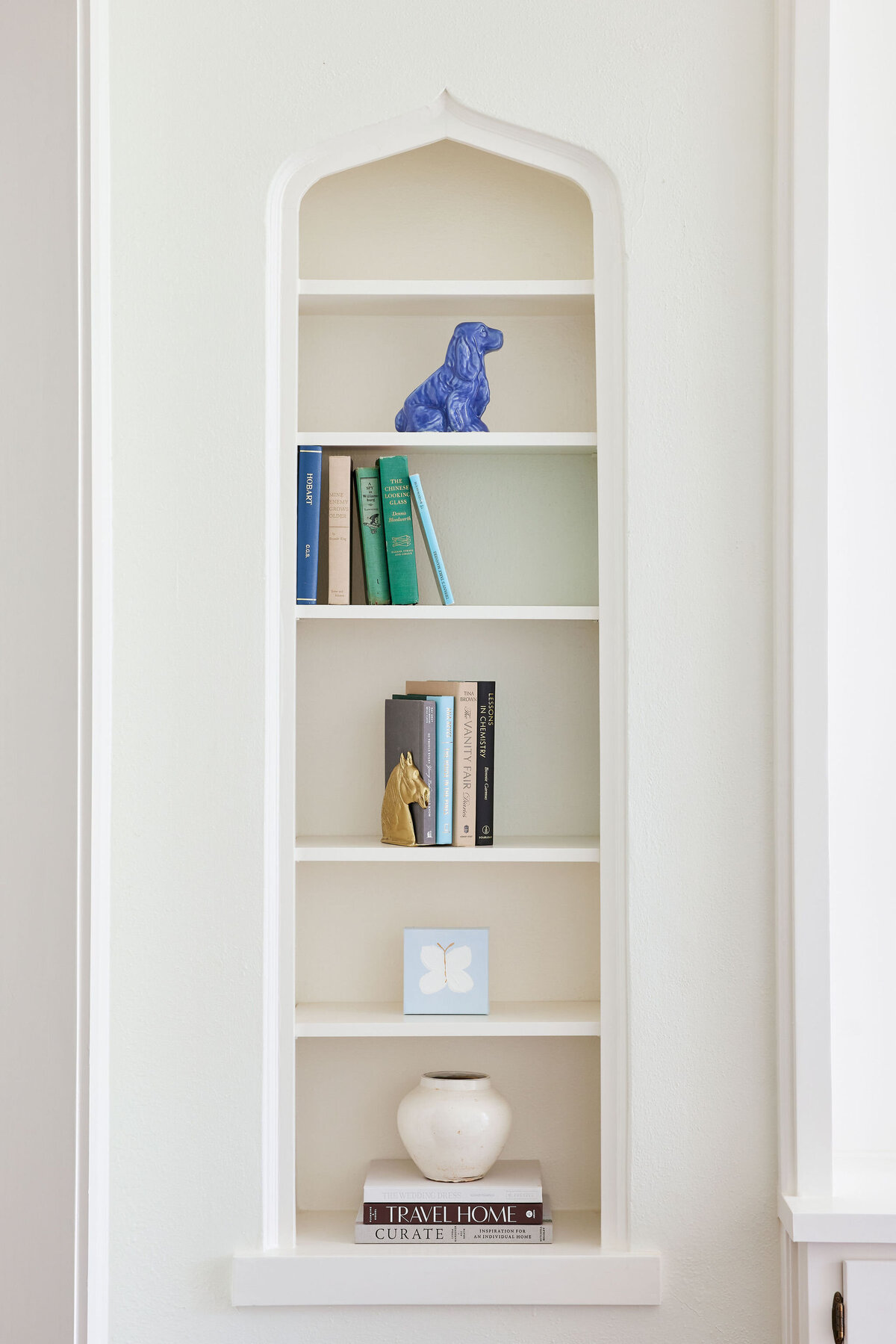 cocoloba homes cockrell ave white wall insert bookshelf in living room