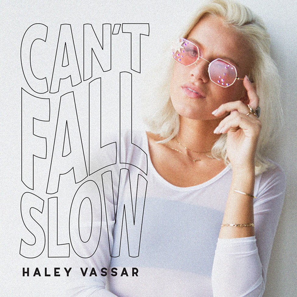 Single Cover Cant Fall Slow Haley Vassar singer in white against white backdrop hand to her pink studded sunglasses