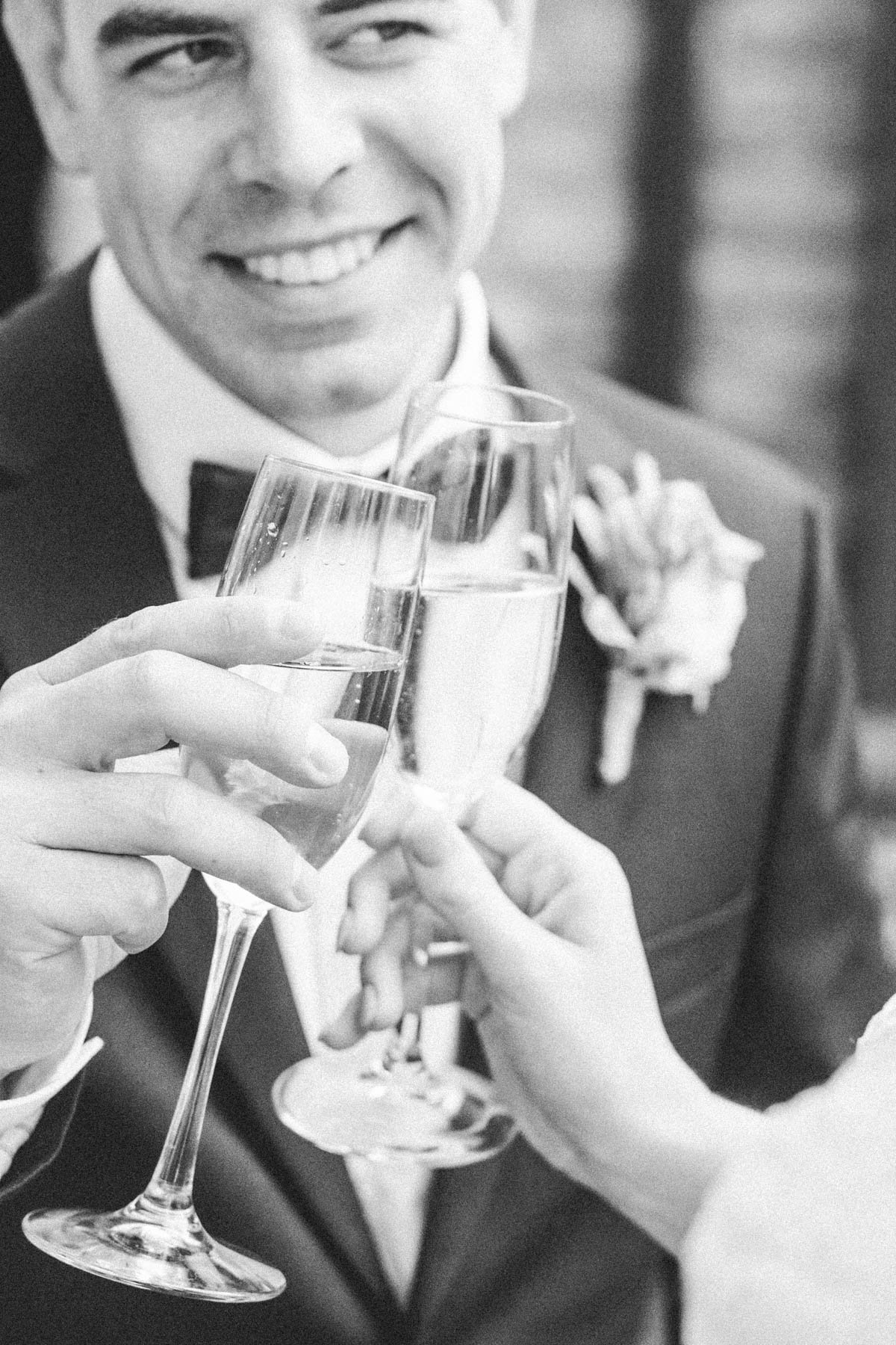bride and groom toast champagne after wedding ceremony rochester minnesota