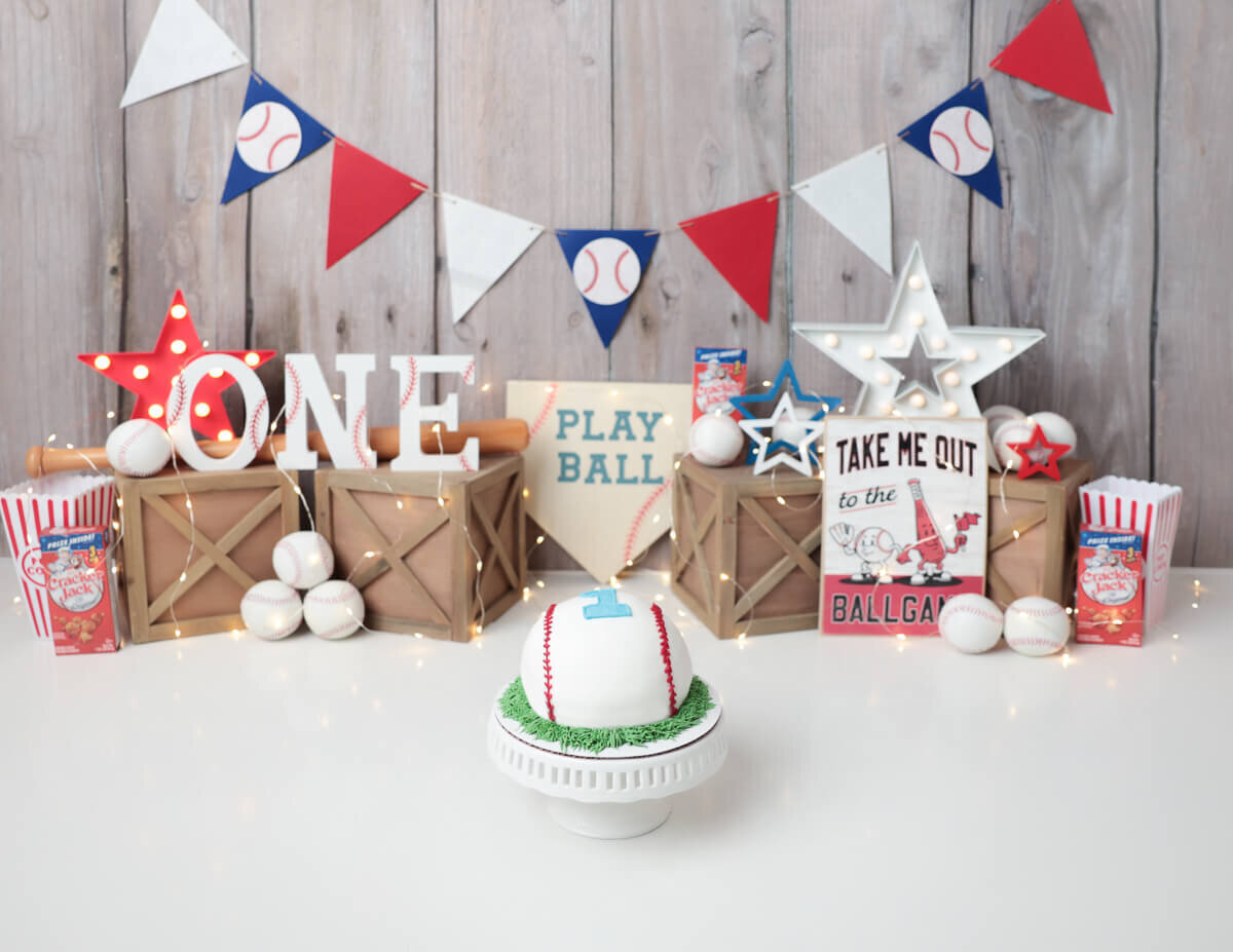 Colorful baseball-themed decorations for a cake smash session in Rochester, NY."