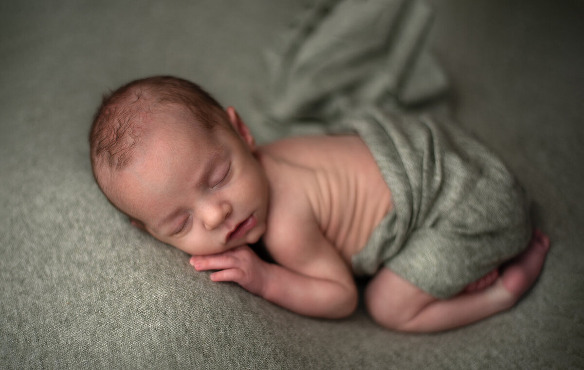 sleeping baby at his newborn session by st louis newborn photographer