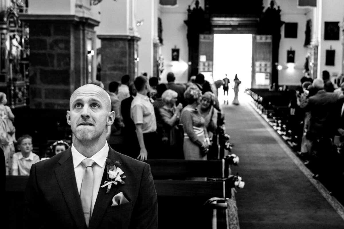 nervous groom waiting for bride