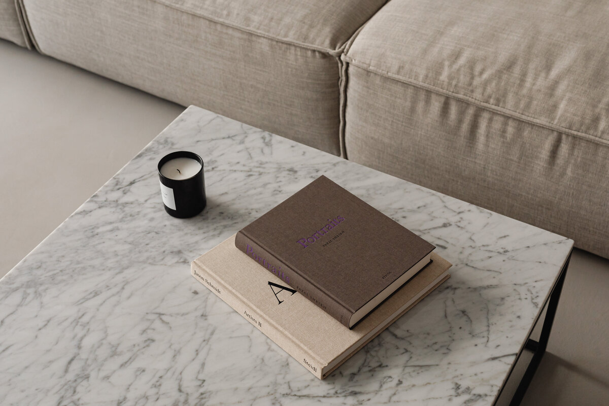 kaboompics_living-room-gray-beige-sofa-marble-coffee-table-coffee-table-books-candle-29393