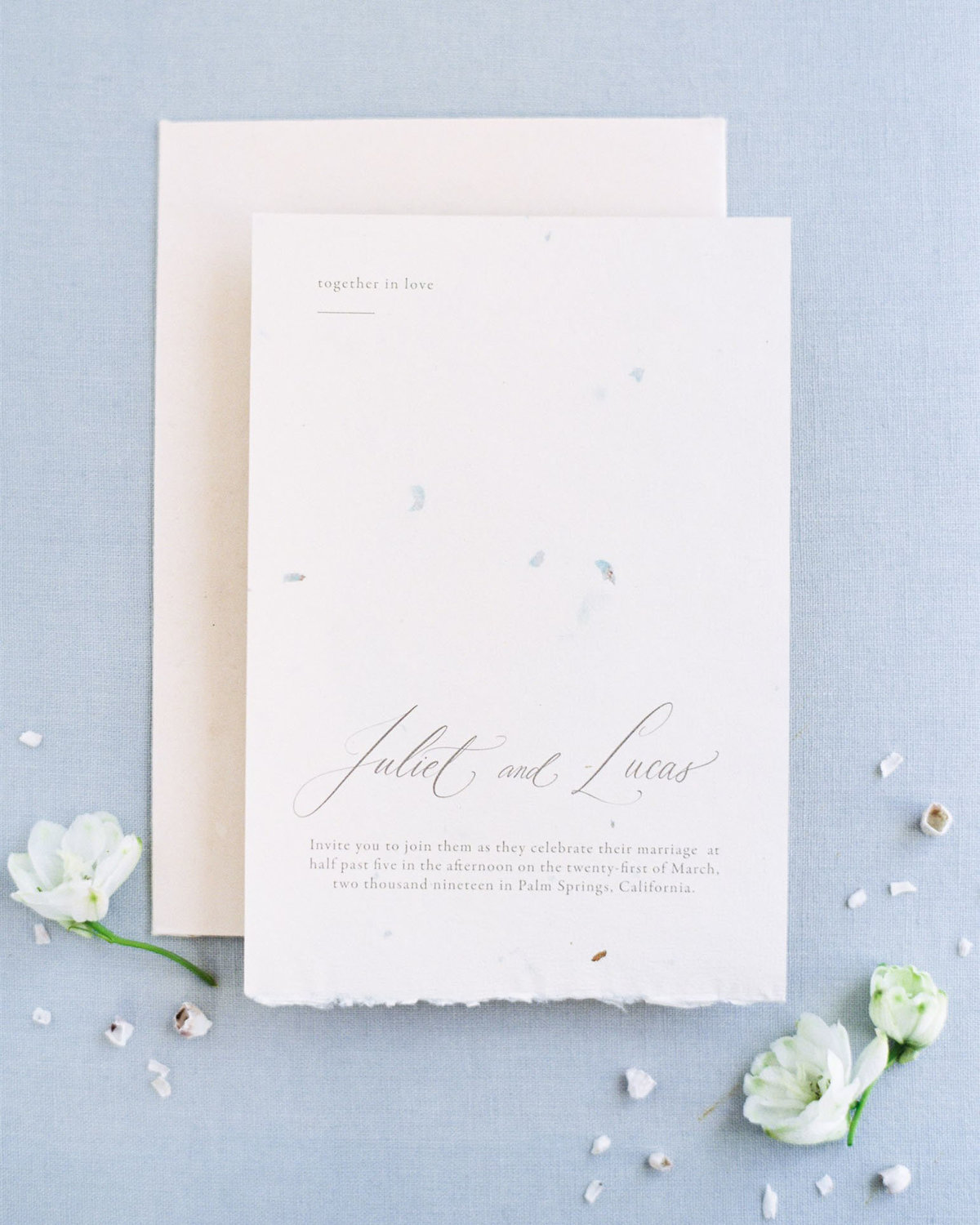 Dominique Alba mininal romantic calligraphy and type invitation card on seed paper