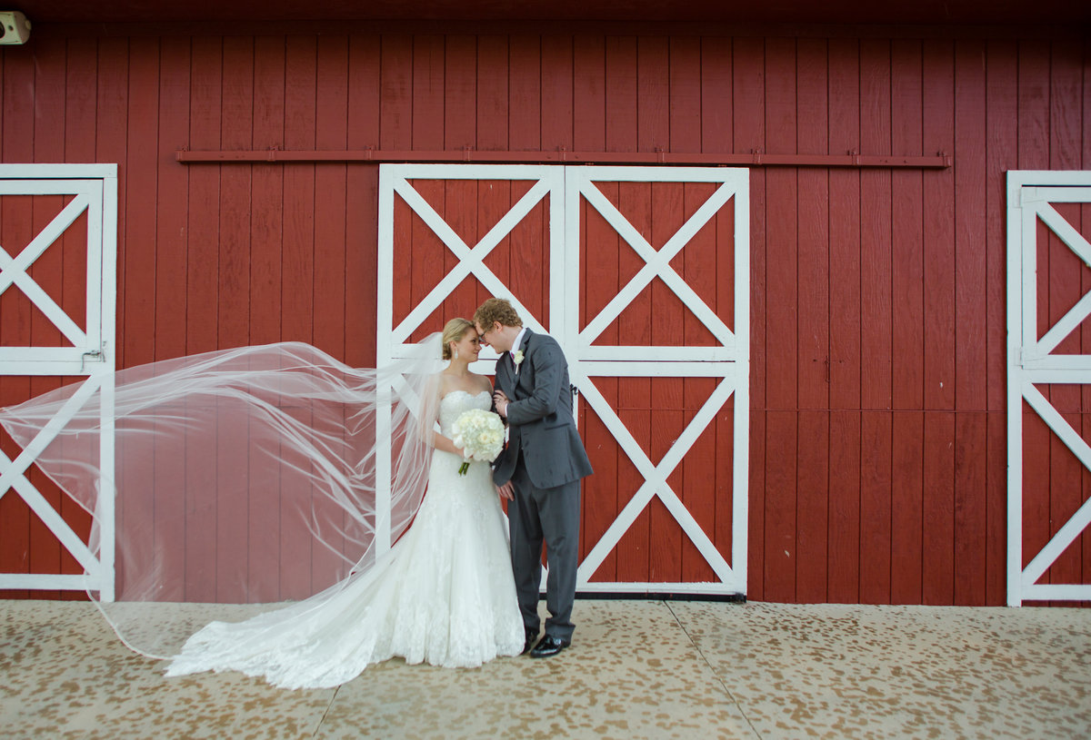 couple red barn at crooked willow