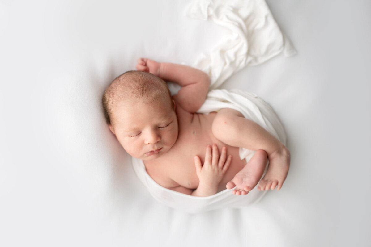 Newborn session of baby boy sleeping