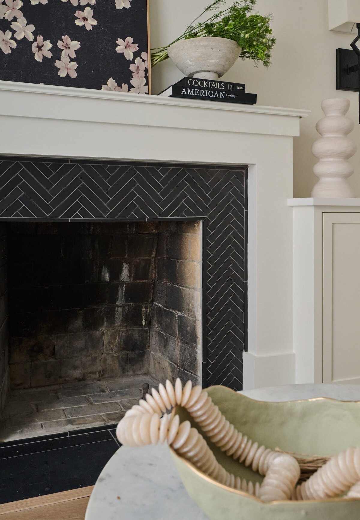 cocoloba homes graham black tile herringbone fireplace