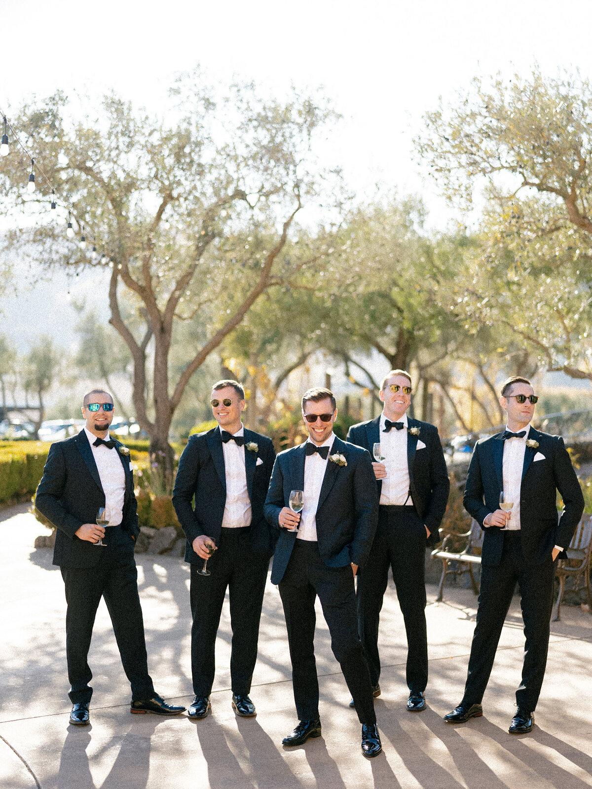 Groomsmen happily posing for photo photographed by Chicago editorial wedding photographer Arielle Peters