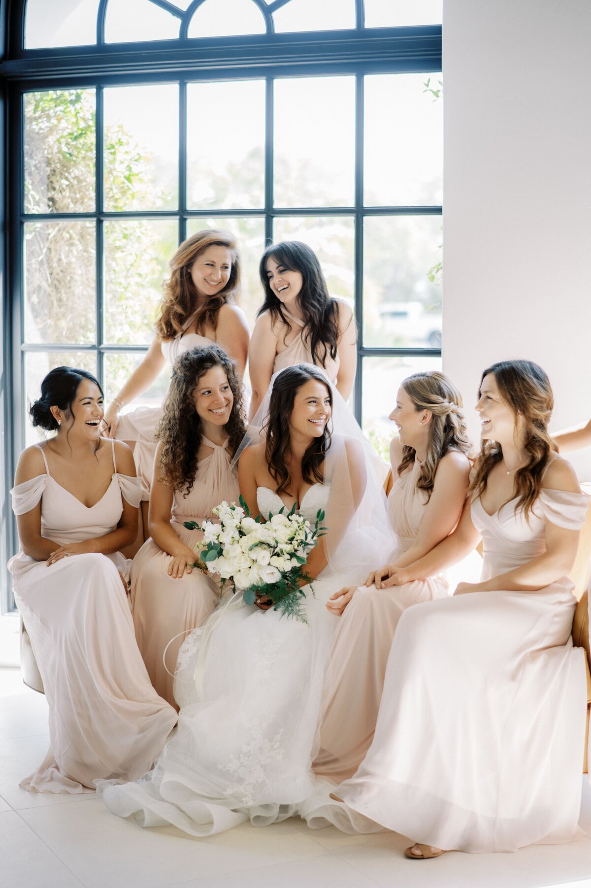 The bouquet stands out amongst the bride and her bridesmaids.