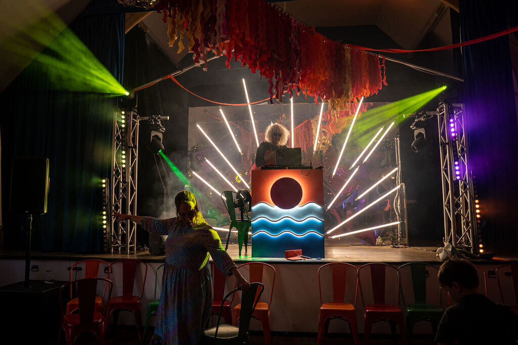 Umbrella centre wedding reception, disco lights and dancefloor