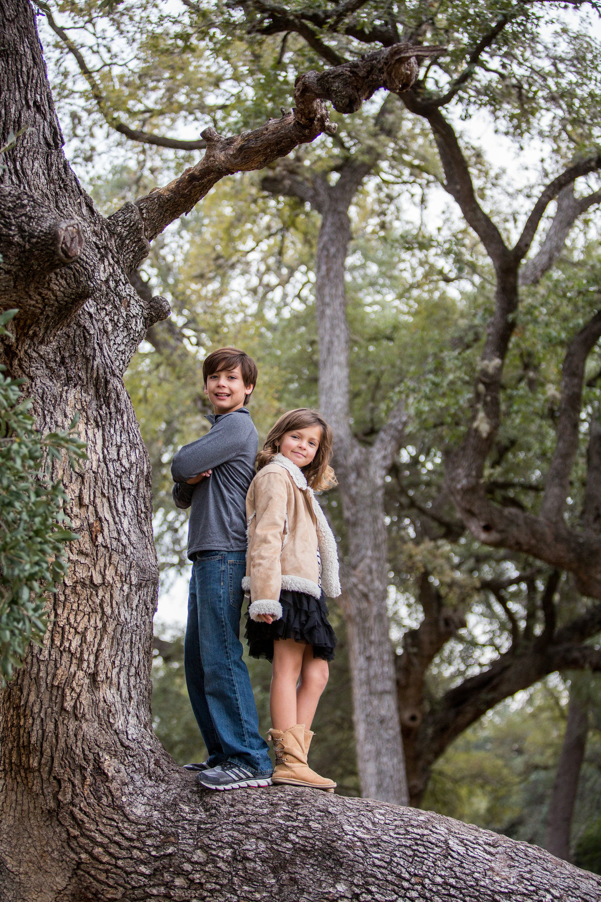 brother & sister standing tree branch for family photography taken by San Antonio Photographer Expose The Heart Photographer