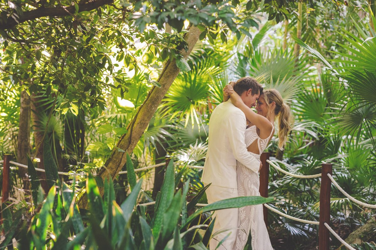 Bride and groom in romantic post at viceroy riviera maya