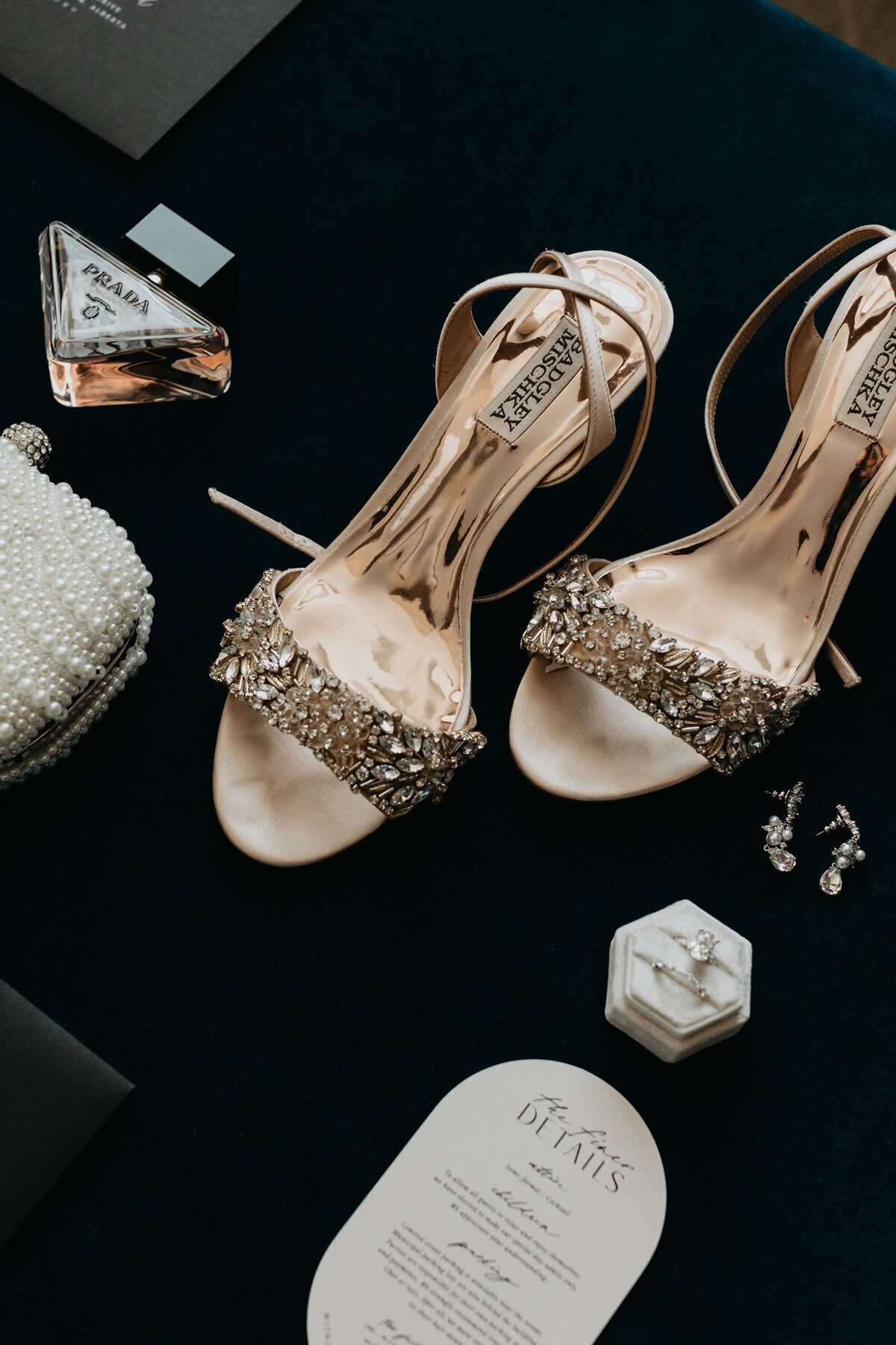 Bride's shoes laid out with her wedding accessories.