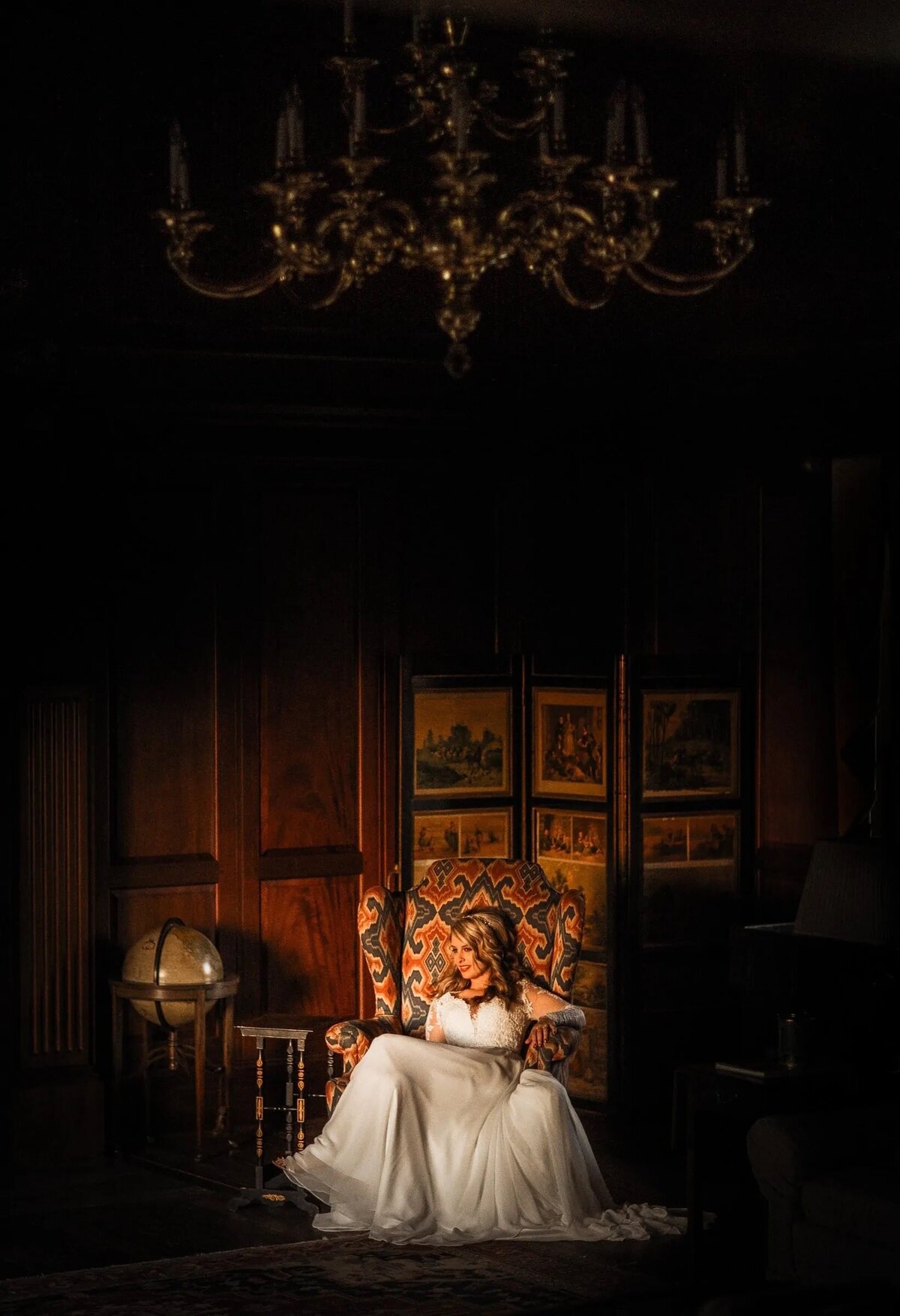 A bride sitting in a large decorative chair