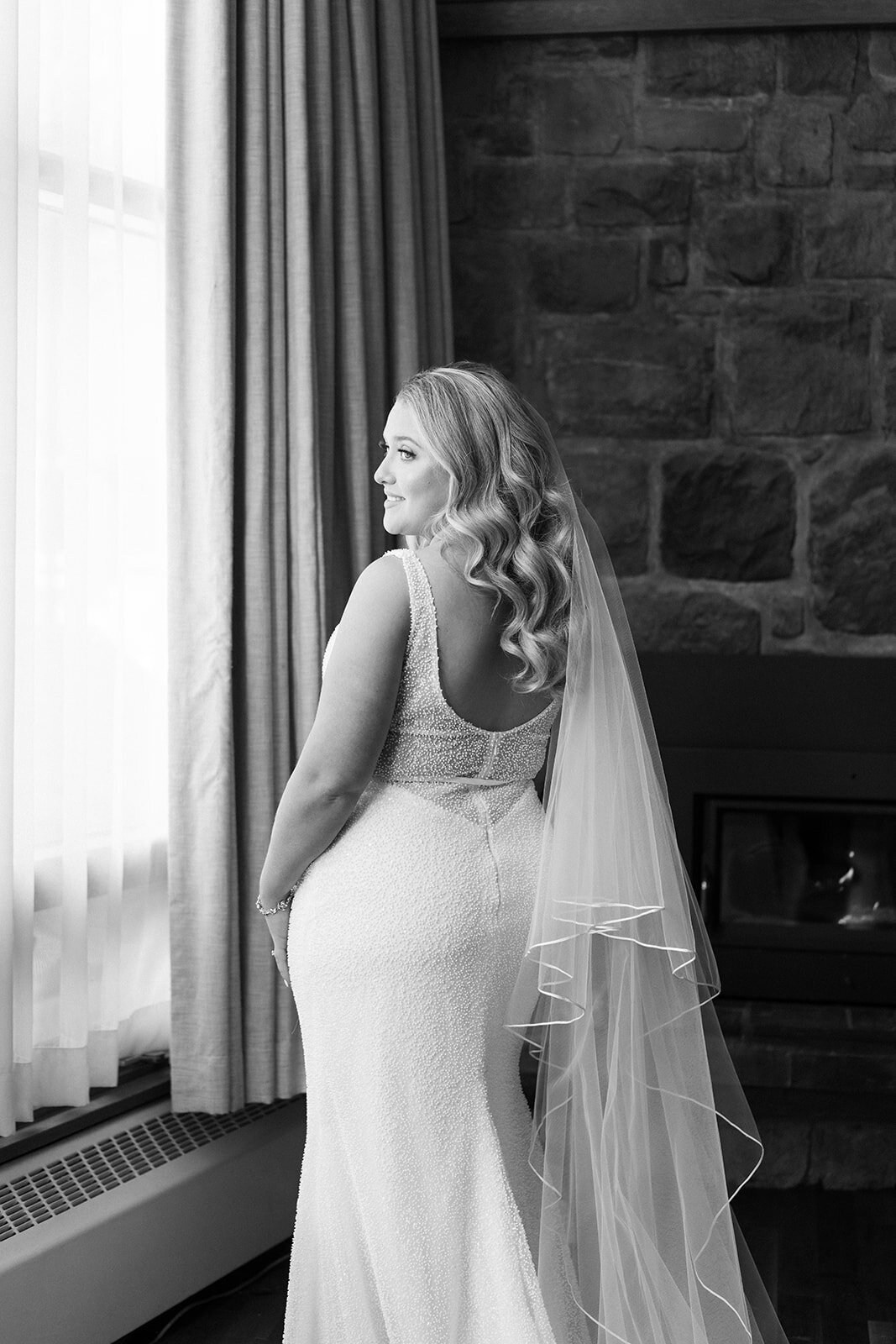 Black and white portrait of the bride in her wedding dress.