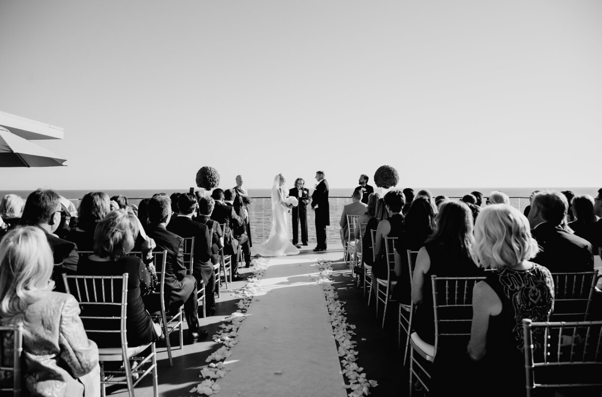 Photo of couple having a beach wedding