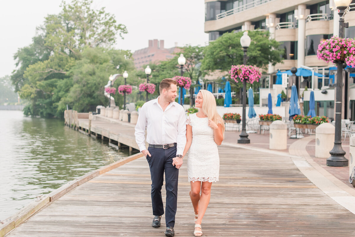 Georgetown boardwalk couple walking white dres black pants and white button up