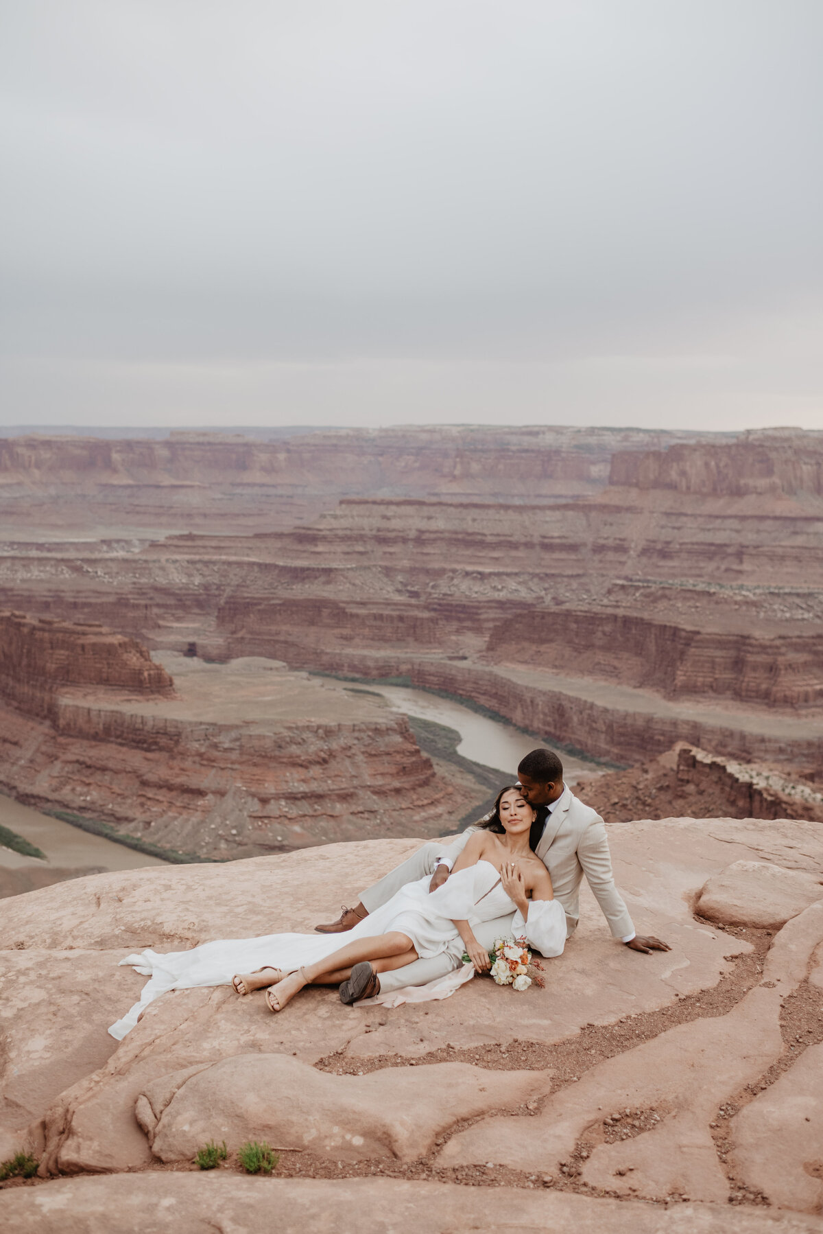 Utah Elopement Photographer captures bride and groom laying down together