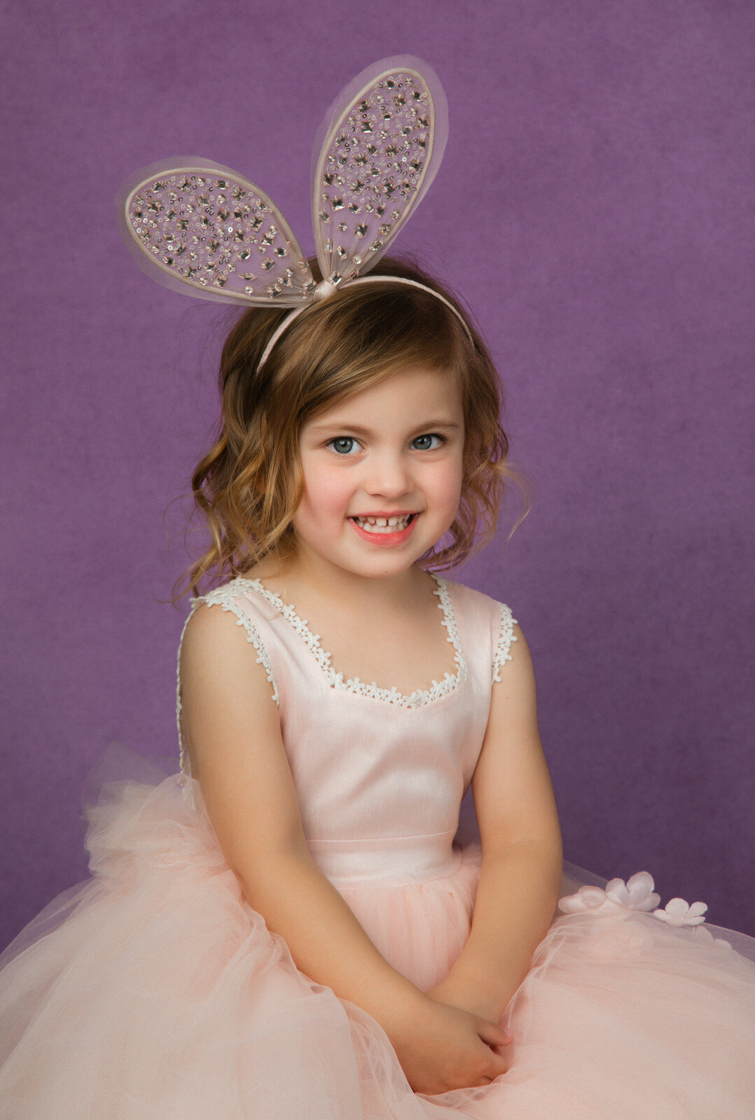 girl-in-studio-wearing-pink-bunny-ears-with-pink-dress-for-spring-portraits